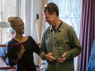 Dr Tom Welsh receiving his award